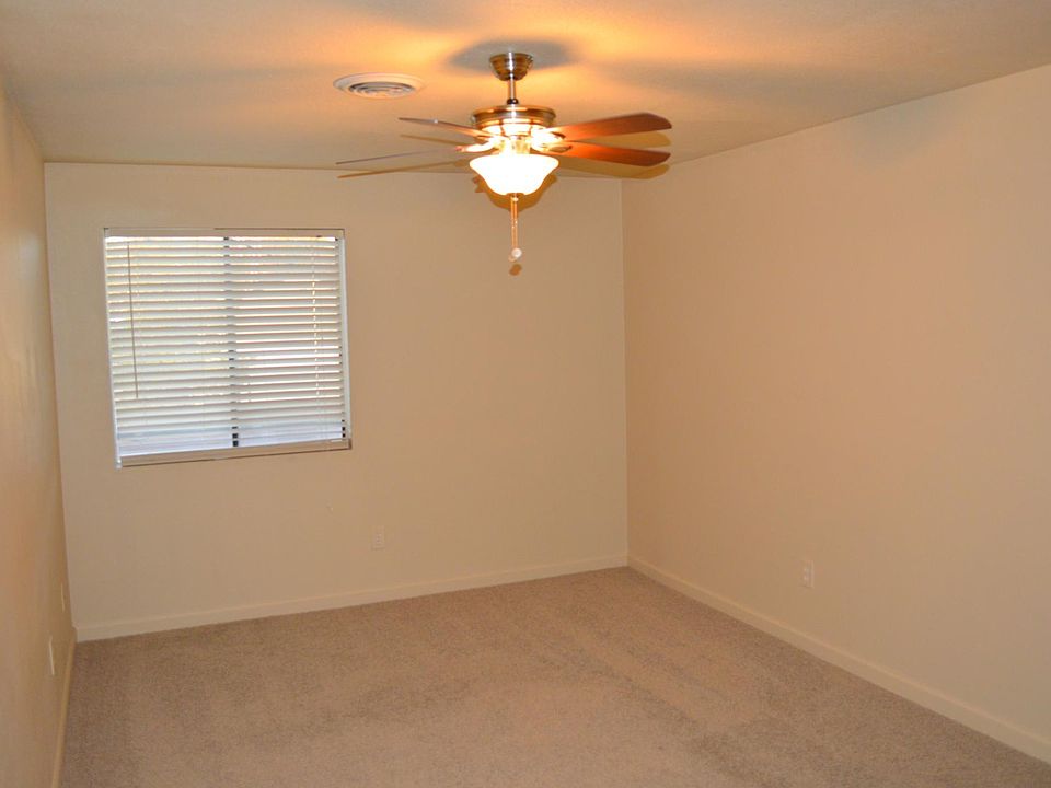 View of primary bedroom from bathroom door