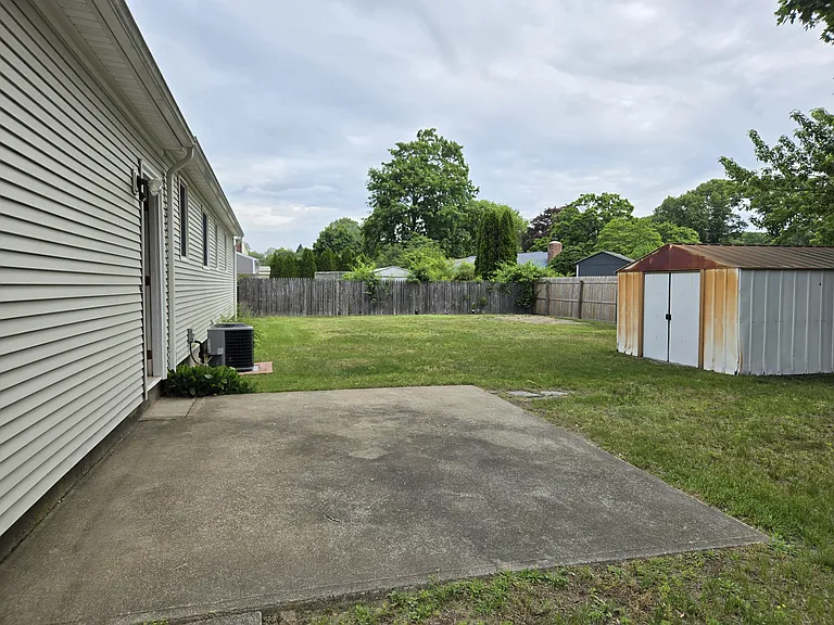 Back yard, patio and equipment shed