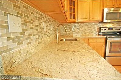 High-end granite and glass tile mosaic backsplash