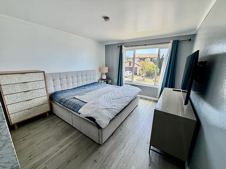2nd Floor Master Bedroom with Cal-King size bed and large TV, with ocean views
