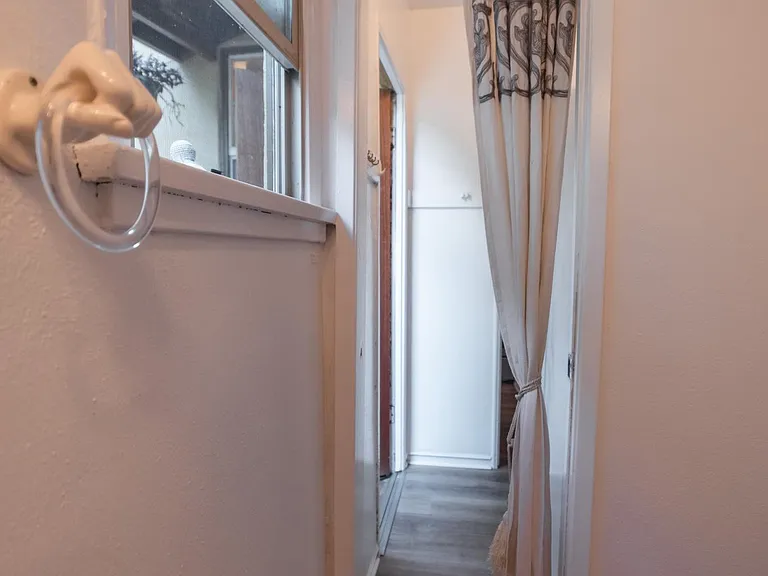 1/2 bathroom looking to back entry