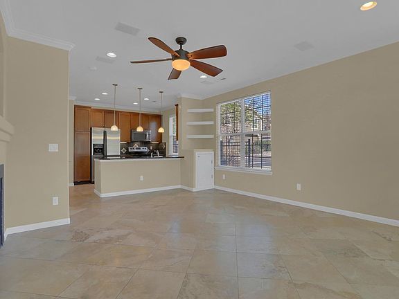 Family Room and Kitchen with Travertine Tile Floors, New Paint.