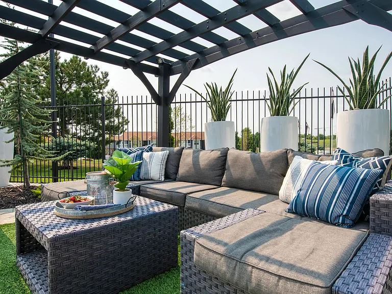 Relax under the poolside pergola, offering shaded tranquility and plush loungers for a luxury-filled escape on the deck.