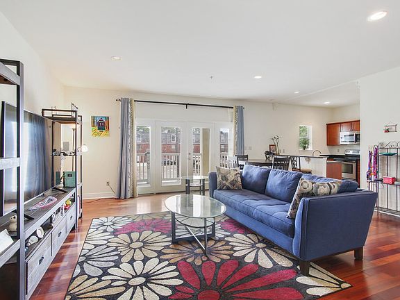 The French doors open to the wide balcony.