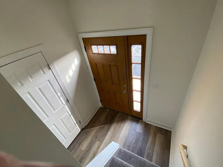 Inside Foyer with half bathroom in hallway