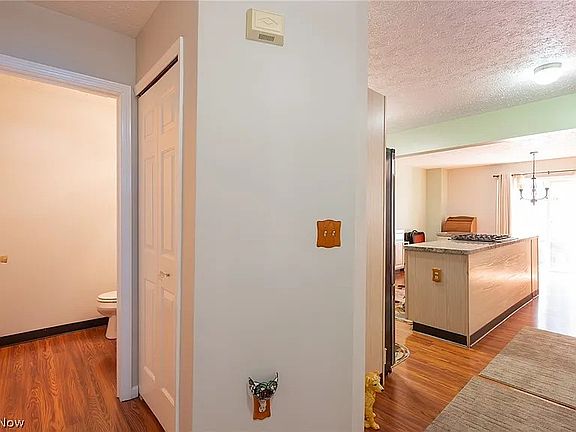 Entry way from garage & front door. 1/2 BA on left, kitchen/dining/living room ahead, stairs to the right