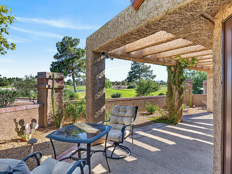 Quaint table for two to enjoy morning coffee while overlooking the stunning golf course