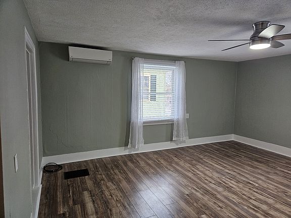 Living Room showing air-conditioning unit.
