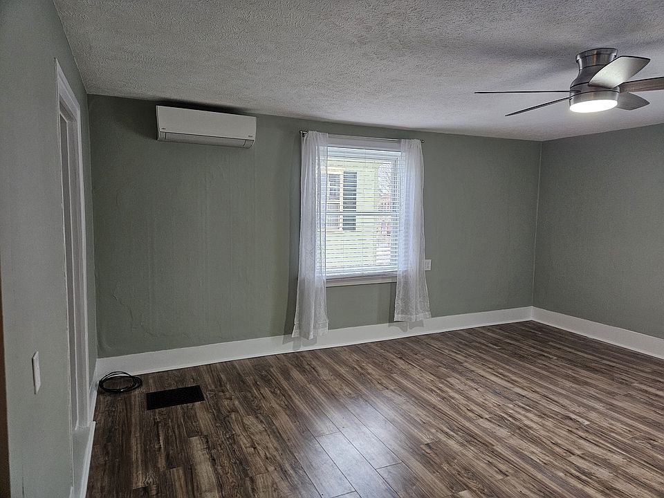 Living Room showing air-conditioning unit.