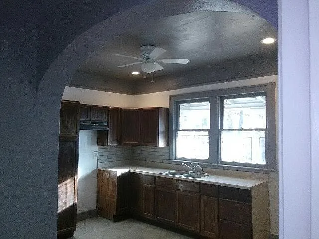 new cabinets, countertops, tile floor, lighting, sink