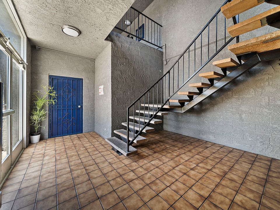Clean interior corridor with convenient stair access to upper-level units.