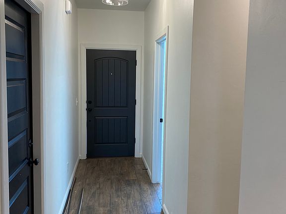 Front Door (Entry to Garage on Left, Entry into Bedroom #2 on Right)