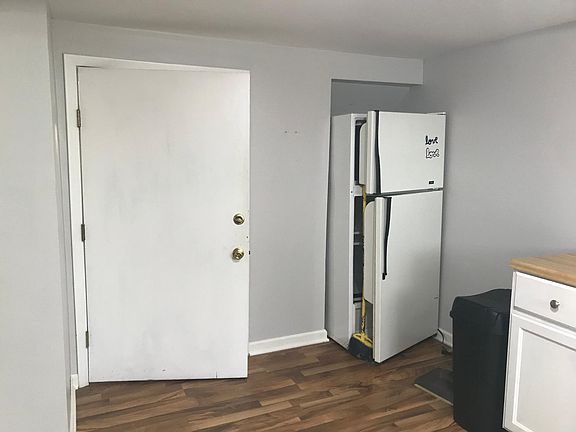 Entry door and part of kitchen