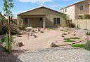 Hard landscaped w/timed lighting and pave brick patio along fence line 