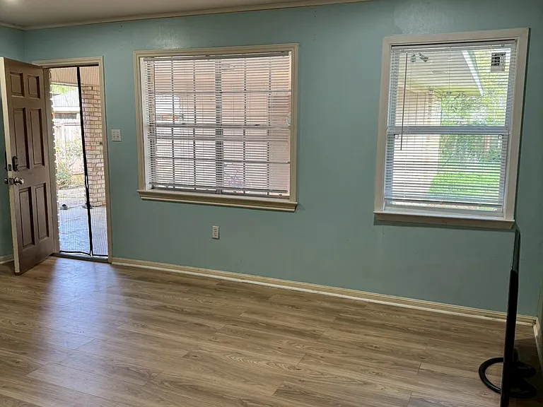 ___ Living Room
"Bright and spacious living area with new wood-look flooring and plenty of natural light. A cozy space to relax, gather, and entertain."