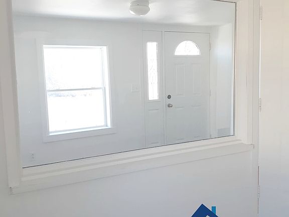 View of mudroom and front door from livingroom