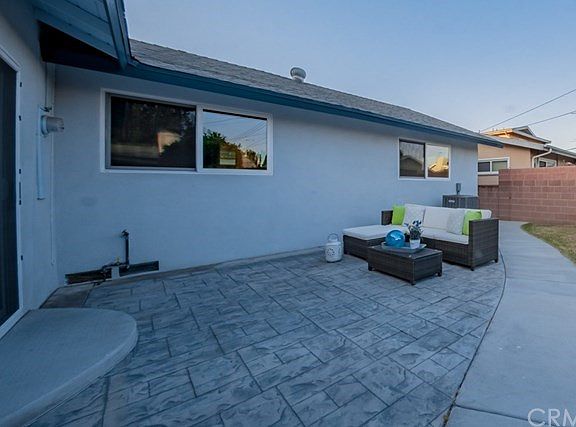 Taken at twilight. Room for a BBQ and entertaining! The backyard has a fruit tree, too.