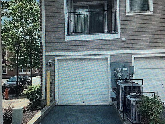 Back of corner unit - Garage, Parking Pad & Balcony off of Kitchen and Master Bedroom