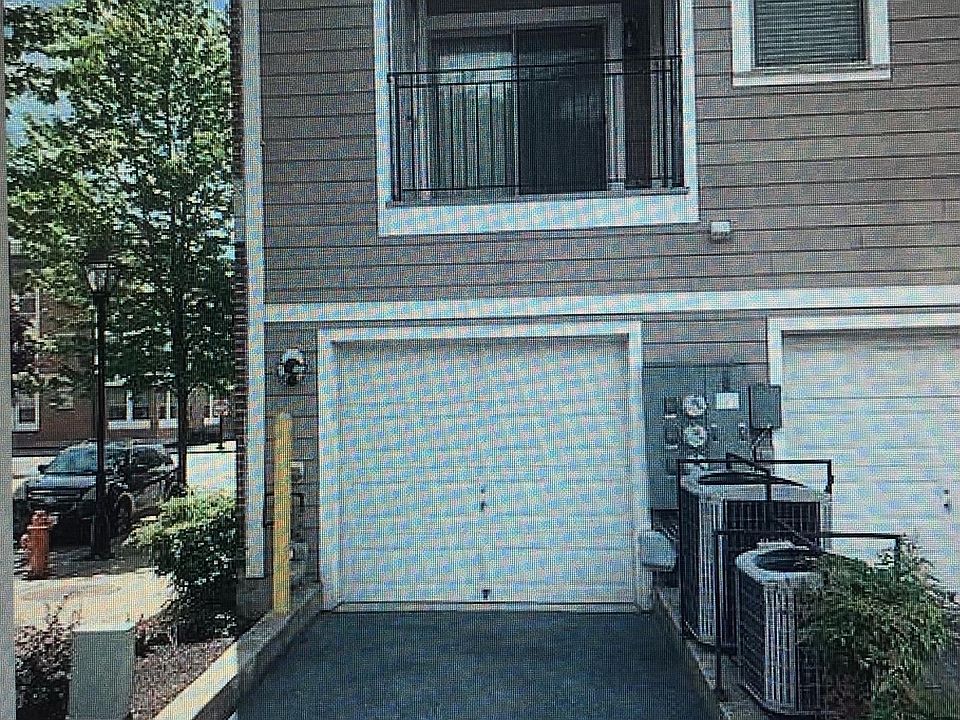 Back of corner unit - Garage, Parking Pad & Balcony off of Kitchen and Master Bedroom