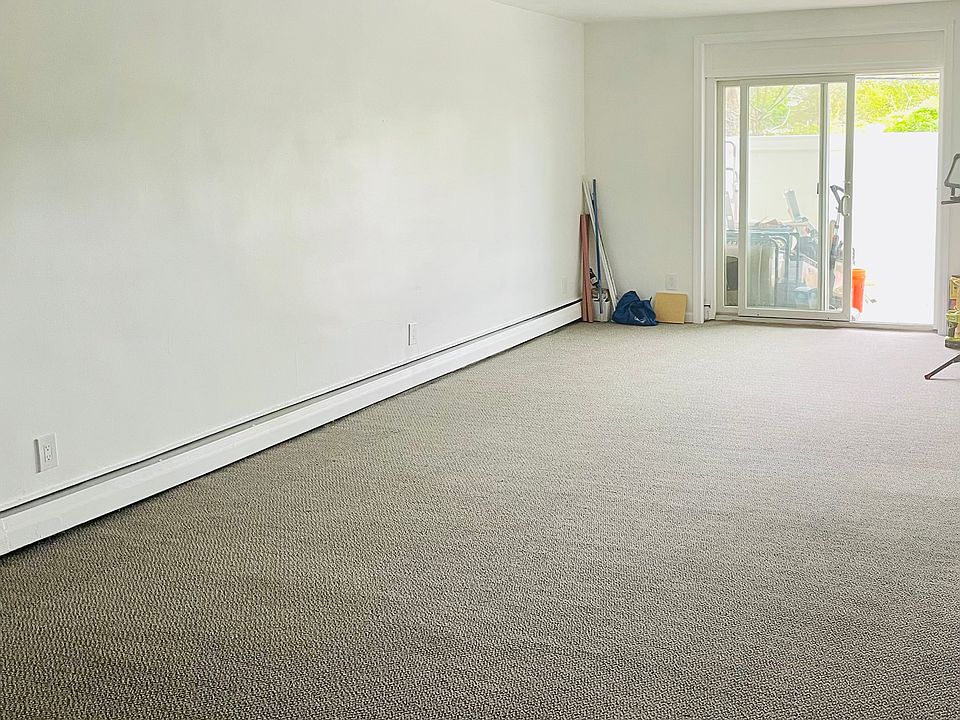 Large living room with sliders out to patio .
Parking Rt outside patio