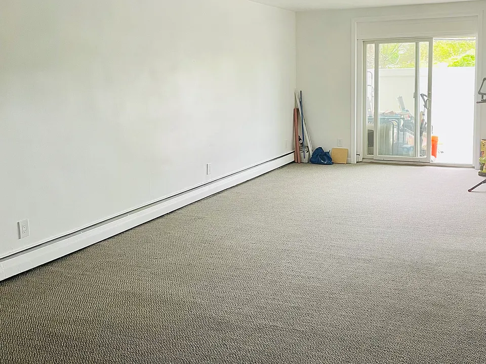 Large living room with sliders out to patio .
Parking Rt outside patio