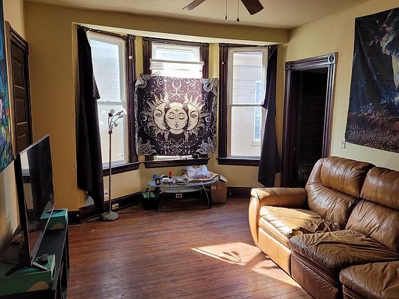 Unit #2 Entry, Good Size Lving Room, 14 x 12. Lots of good lighting. Will paint windows and baseboards white. Will be nice and clean when moving in.