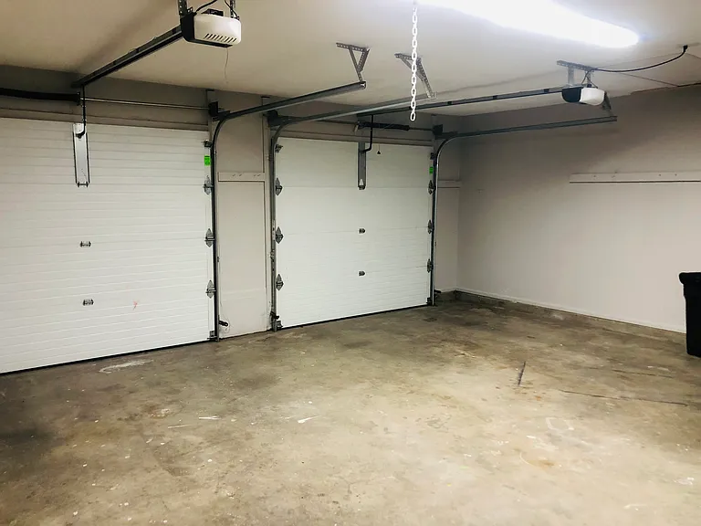 Full two car garage with openers. Plus exterior brick paver parking for one additional car. Plus street parking.