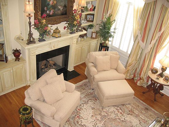 Formal living room with fireplace and built-ins