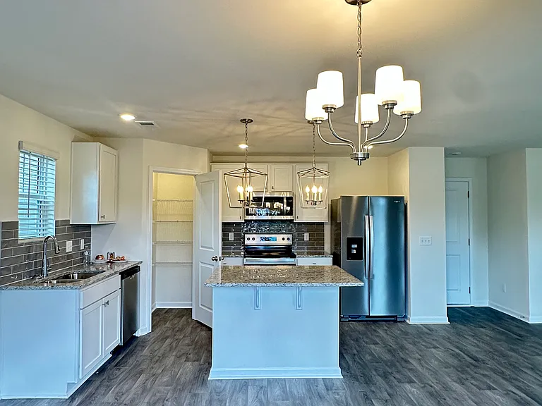 Beautiful kitchen includes all appliances, granite countertop, pantry closet.
