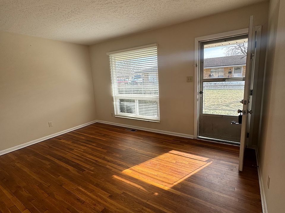 Living room, has large picture window with plenty of light!
