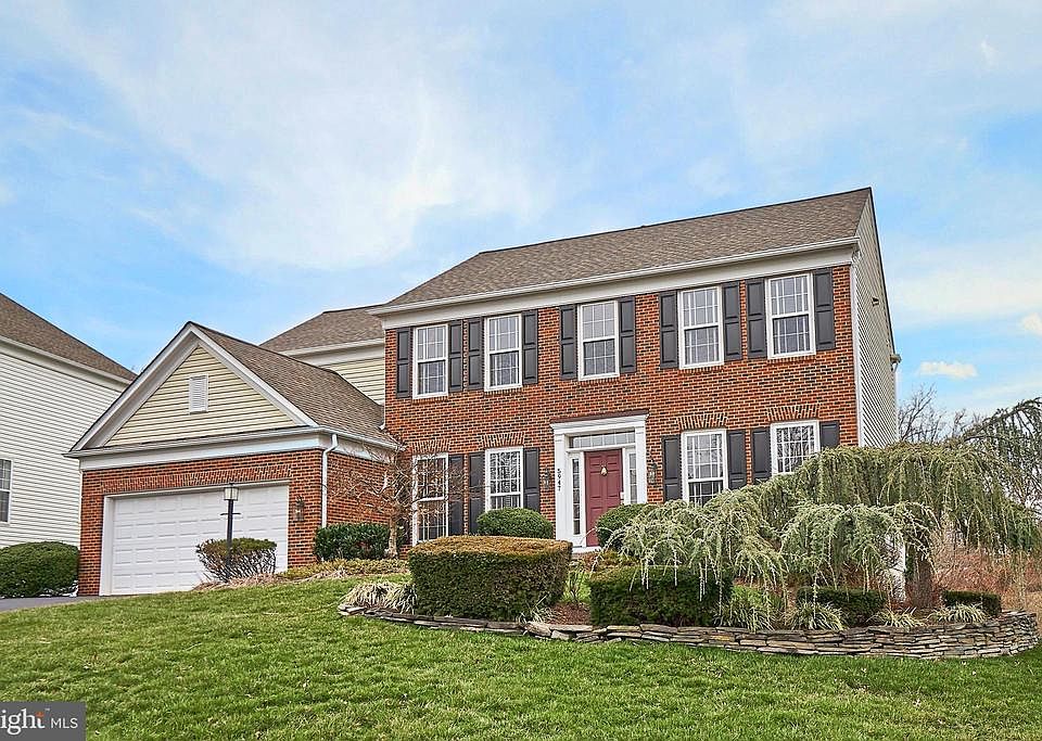Great curb appeal in this brick front Colonial
