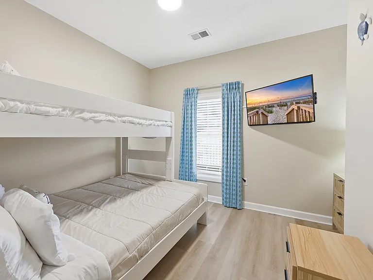 A comfortable bunk bedroom ideal for relaxing after a day of adventure.