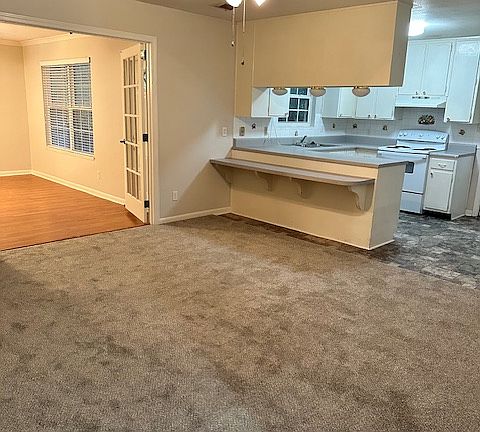 Dining room and kitchen and entrance into bonus room