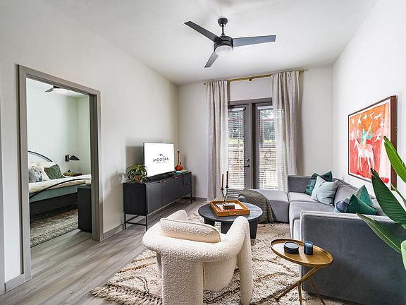 Relax and unwind in style in the inviting living rooms of Modera EaDo, where comfort meets contemporary elegance.