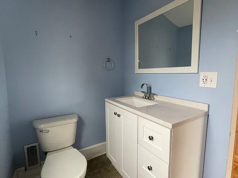 Convenient main-level half bathroom for guests.