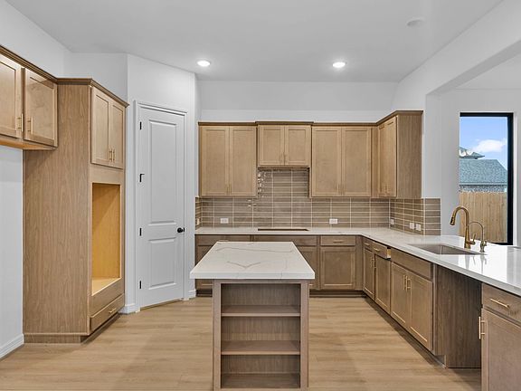 Kitchen. Sample product photo. Actual exterior and interior selections may vary by homesite. Photo m