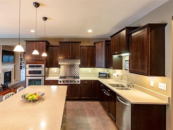 Staggered cabinets in this gourmet kitchen.