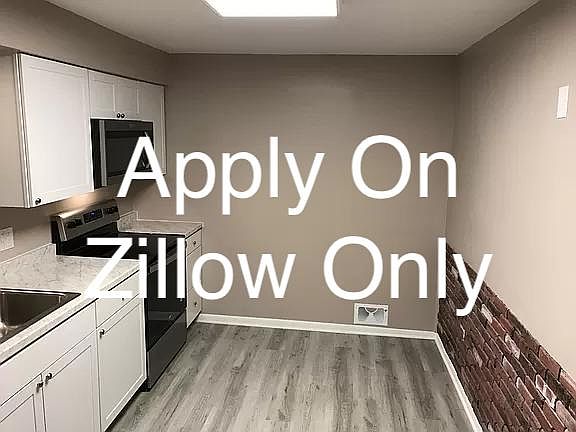 New Kitchen with shaker cabinets, stainless appliances including microwave oven and dishwasher. Room for a table to enjoy your family meals.