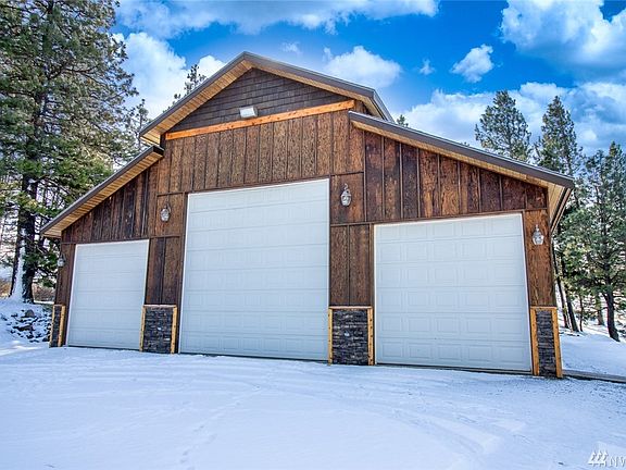 Phenomenal 3 bay detached shop! Propane radiant heat, built in speakers, fully finished inside! Wired for welding on a separate power meter, Rv power plug inside AND outside.