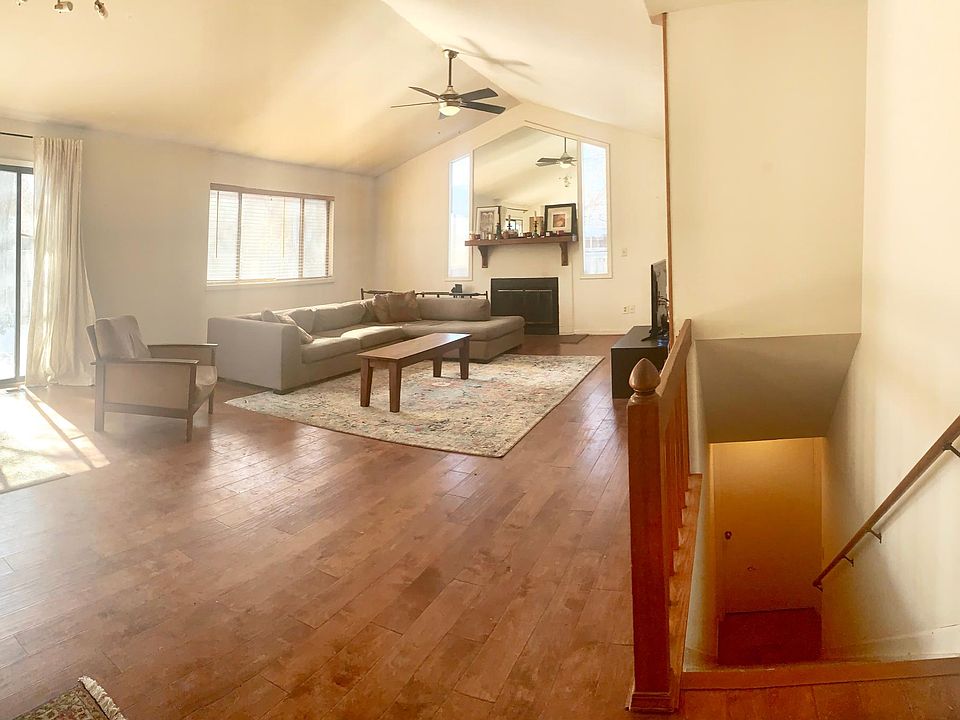 Main living room. Stairs to the finished basement are on your right. Patio door to backyard is visible on your left. Just out of view to the left is the kitchen and dining room.