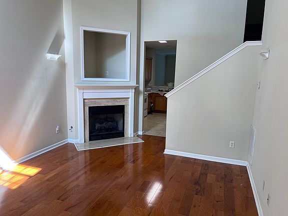 Family room with cathedral ceiling and gas fireplace.