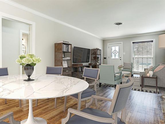 Spacious dining area can accommodate a large table and chairs, and it is situated conveniently off the updated kitchen.