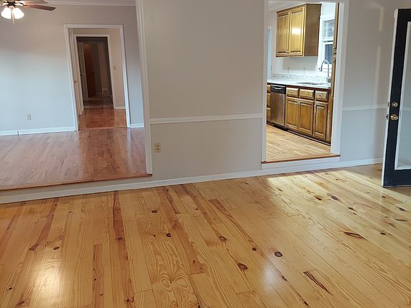 new floors, new paint, new counter tops, new tankless water heater, new front door, fenced yard with storage shed - beautiful home