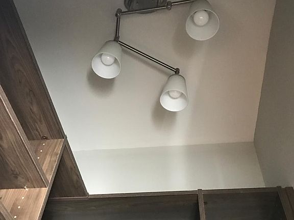 custom lighting in spacious walk-in closets