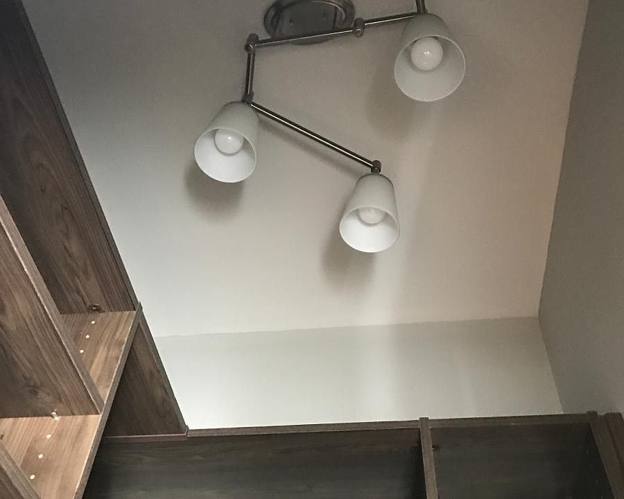 custom lighting in spacious walk-in closets