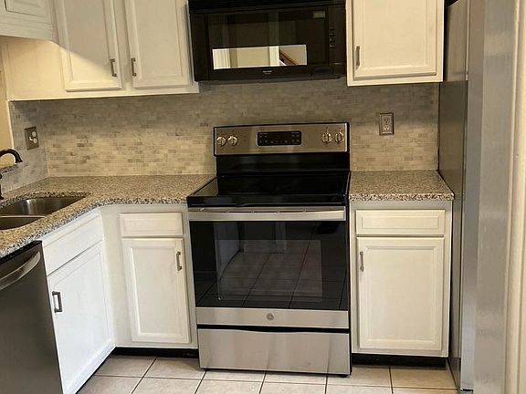 Kitchen with new appliances and granite counters
