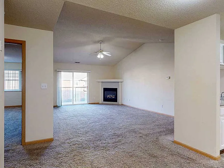 Spacious living and dining areas flow together effortlessly, creating a warm and welcoming space for everyday living or entertaining by the fire.