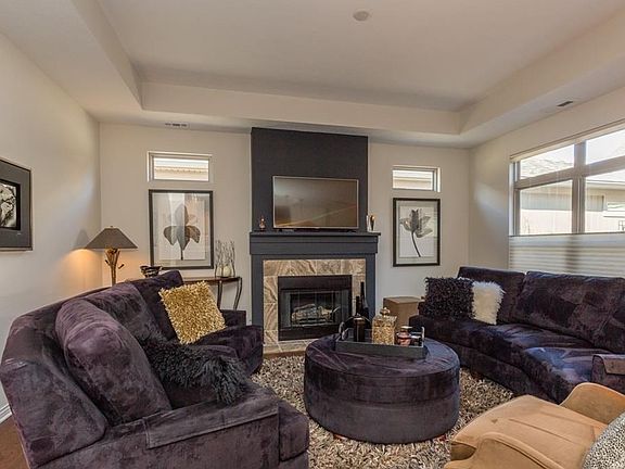 In the great room the sellers who were extremely detailed oriented, had the wall above the marble gas fireplace wired for flat screen television.  Also, see that the custom blinds lower from the top or the bottom depending on your lighting mood.  Ceiling 
