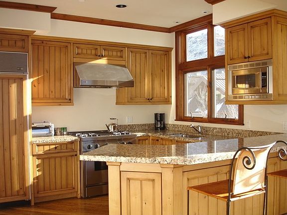 Open kitchen with top-of -the-line appliances and granite counters