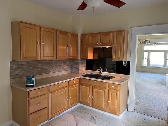 Kitchen, stainless steel French door refrigerator and induction stove included